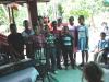 A group of children singing at a church service